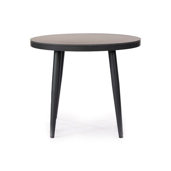 Mesa de comedor minimalista con cubierta redonda y patas metálicas negras delgadas, diseño simple y moderno.